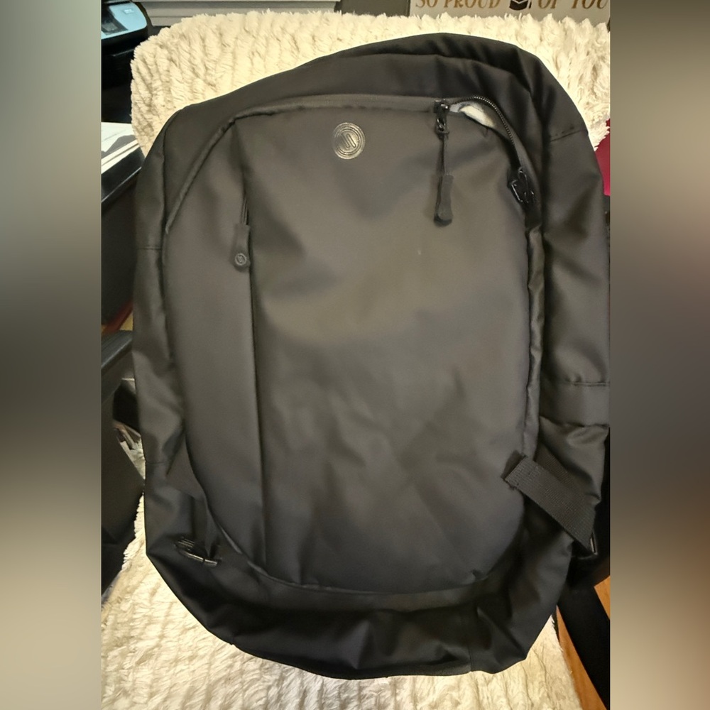 Black Backpack with Multiple Compartments and Padded Back